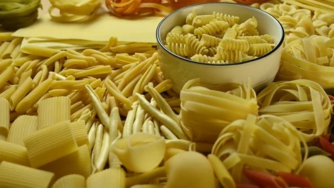 Different types of pasta lie on the table Video stock 126245723