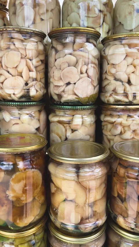 Different types of pickled mushrooms in jars. Stock Footage 314094207