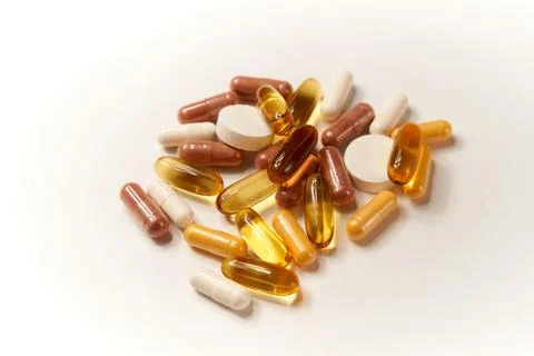 Different types of pills and tablets on clean background Stock Photos