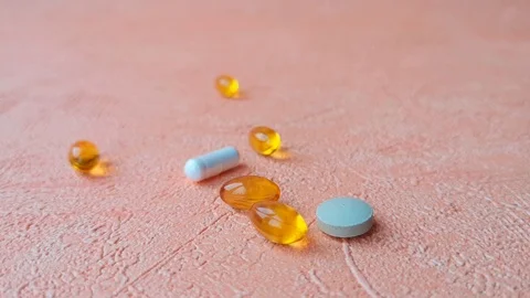 Different types of pills. Female hand takes a round pill. Stock Footage 103857445