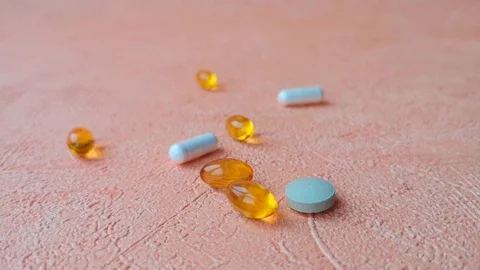 Different types of pills. Female hand takes a white pill. Stock Footage 103857448