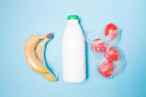 Different types of plastic packaging on a blue background, a package with tom Stock Photos