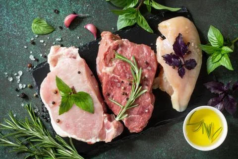 Different types of raw Fresh Meat, chicken fillet, pork and beef. Stock Photos