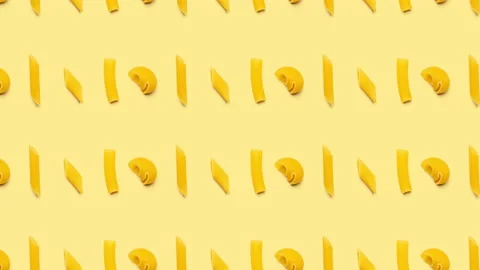 Different types of raw pasta background, seamless looping. 4K Stock Footage 130973483