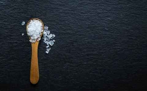Different types of salt. Top view on two wooden spoons Stock Photos