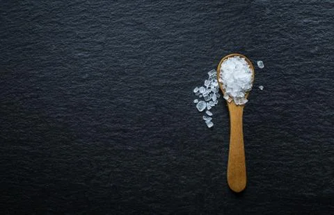 Different types of salt. Top view on wooden spoons Stock Photos