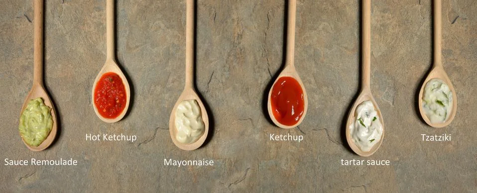 Different types of sauces in spoons Free Stock Photos