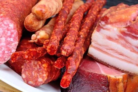 Different types of sausages in a plate on table 스톡 사진