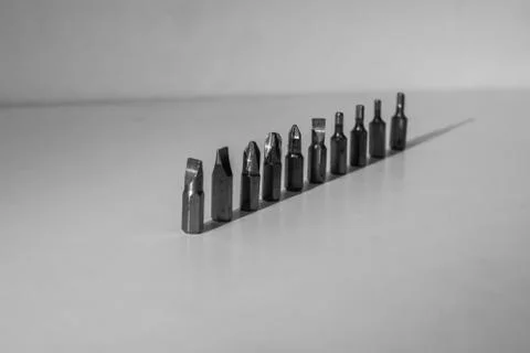 Different types of screw bits of screwdriver isolated on white background. Stock Photos