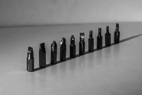 Different types of screw bits of screwdriver isolated on white background. Foto stock