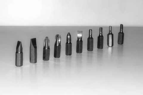 Different types of screw bits of screwdriver isolated on white background. Stock Photos