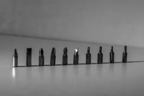 Different types of screw bits of screwdriver isolated on white background. Foto stock