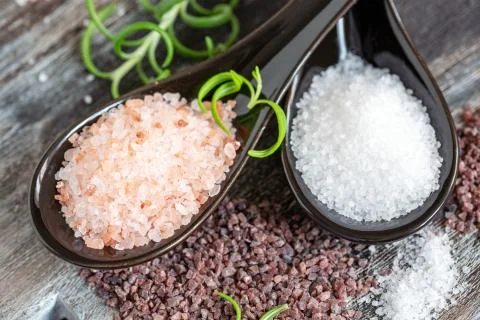 Different types of sea salt close-up. Stock Photos