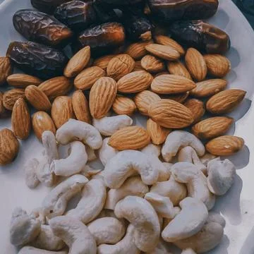 Different types of snack beans in a white dish above me 写真素材
