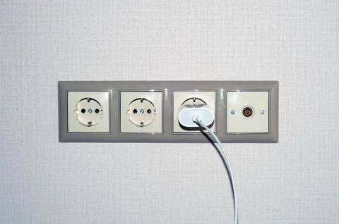 Different types of sockets on the green wall Stock Photos