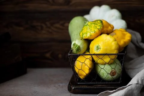 Different types of squash in a wicker basket Stock Photos