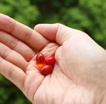 Different Types of Supplement Pills in Man's Palm 스톡 사진