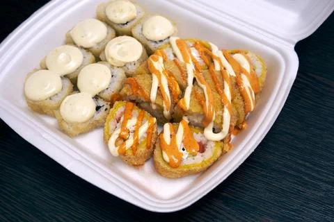 Different types of sushi in plastic packaging Stock Photos