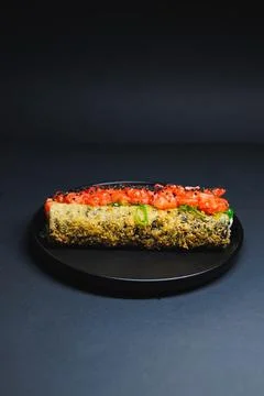 Different types of sushi roll with crispy texture and fresh tomato topping .. Stock Photos