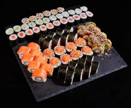 Different types of sushi roll set with salmon, vegetables, fish, avocado, cav Stock Photos