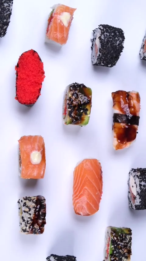 Different types of sushi, rolls with tuna and salmon, rice caviar and fish on a Stock Footage 281948208