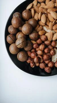 Different types  useful nuts laid out on a plate Stock Photos