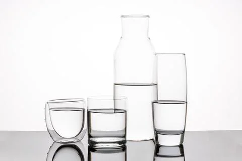 Different types of water containers, glasses on white background Stock Photos
