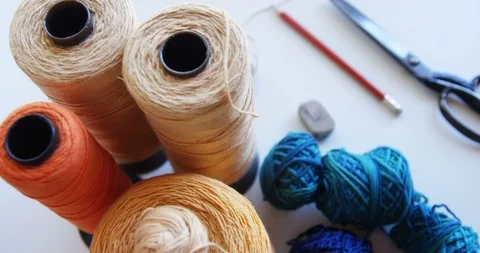 Different types of waving thread kept on table 4k Video stock 88959310