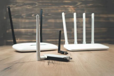 Different types of Wi-Fi routers, modern and old technology. Wireless ether.. Stock Photos