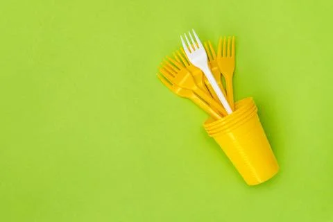 Different, unique white fork standing out of the crowd yellow forks Stock Photos