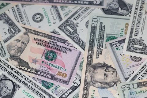 Different US dollar banknotes background Stock Photos