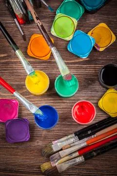 Different used brushes, colours and watercolours Stock Photos
