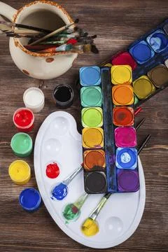 Different used brushes, colours and watercolours Stock Photos