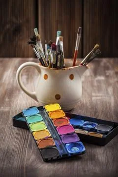 Different used brushes, colours and watercolours Stock Photos