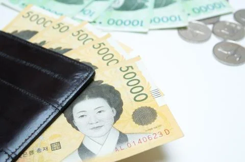 Different value South korean won currency near the wallet on white background Stock Photos