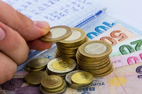 Different values of the paper bills and coins of turkish liras Stock Photos