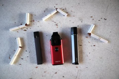 Different vape devices electronic cigarettes juul, aspire breeze, smok infini Stock Photos