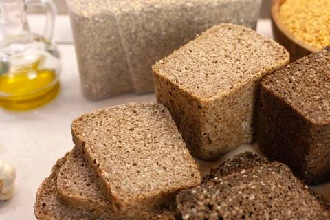 Different varieties of bread on the kitchen table on a light background top view Stock Photos