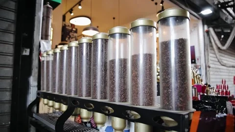 Different varieties of coffee in flasks. Various roasted coffee beans types in Stock Footage 181648535