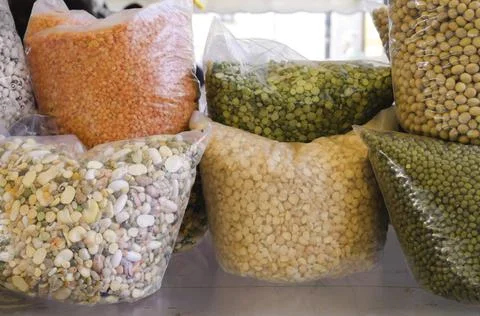 Different varieties of peas, beans and lentils in the street market Stock Photos