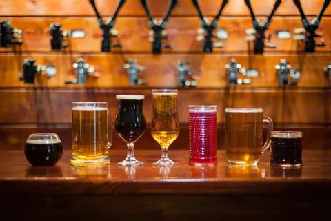 Different varieties of pees are on the bar in the pub.. Stock Photos