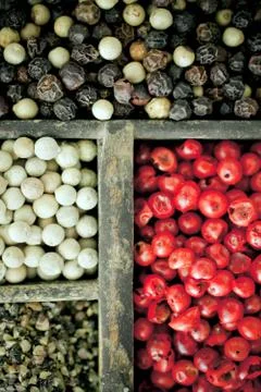 Different varieties of peppercorns Stock Photos