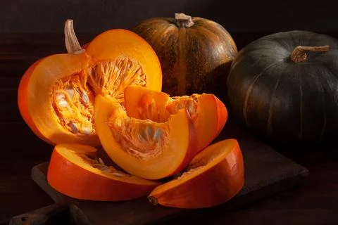 Different varieties of pumpkins on a dark background 스톡 사진