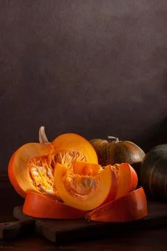 Different varieties of pumpkins on a dark background Stock Photos