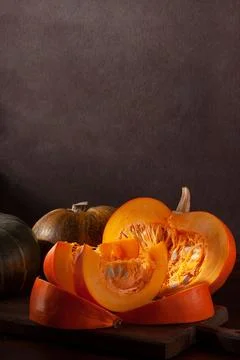 Different varieties of pumpkins on a dark background Stock Photos