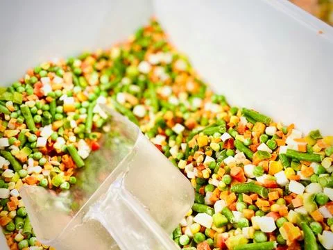 Different vegetable mixtures in the container. Mobile photo. A close-up. Supe Stock Photos