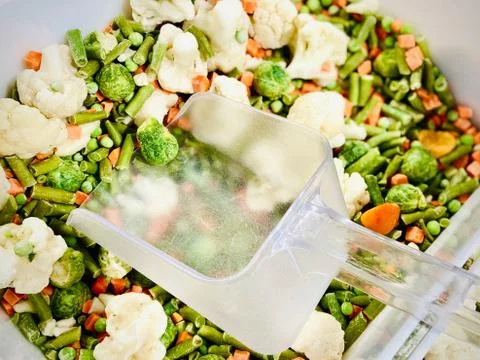 Different vegetable mixtures in the container. Mobile photo. A close-up. Supe Stock Photos