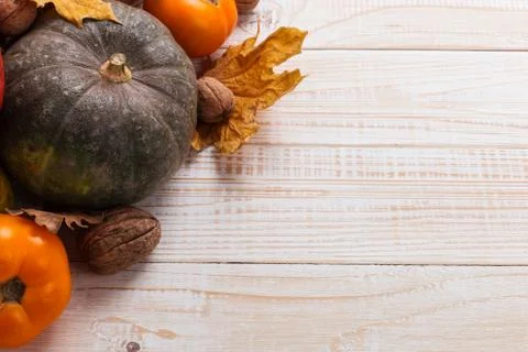 Different vegetables, pumpkins, apples, pears, nuts, tomatoes and dry leaves  Stock Photos