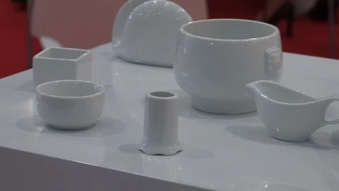 Different white bowls teapots and other assorted china at showroom Stock Footage 85966425