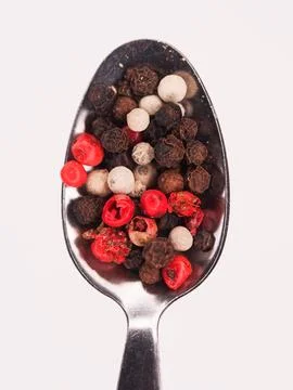 Different whole peppercorns Stock Photos